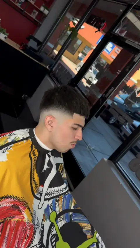 Skin fade with a short textured top, cut by Diana